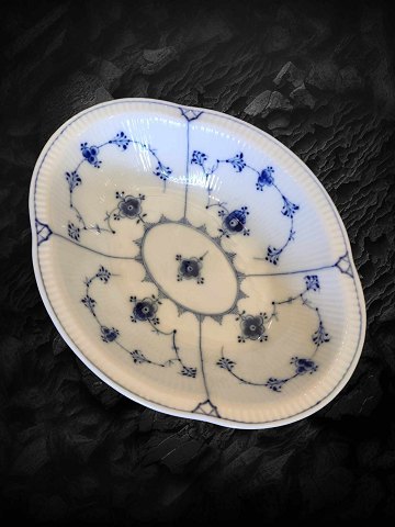Lovely old blue-painted fluted bowl from Bing & Groendahl. Perfect condition but 
has glaze defects above the stamp. (A cross Under the glaze) see picture